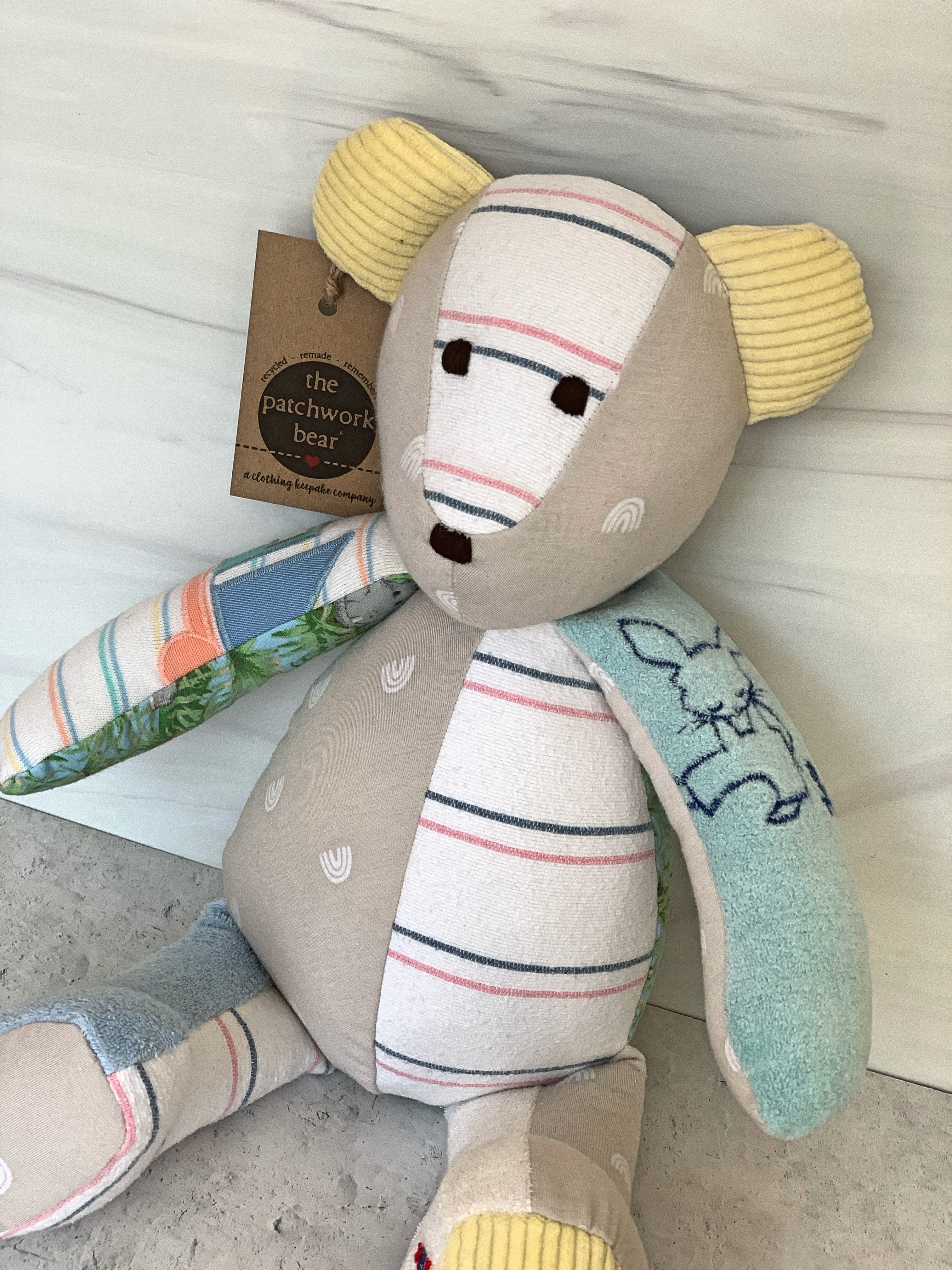 Patchwork teddy bear with tag.