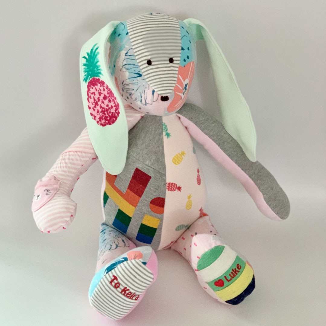 Keira's bunny toy with colorful patches and Hi design.