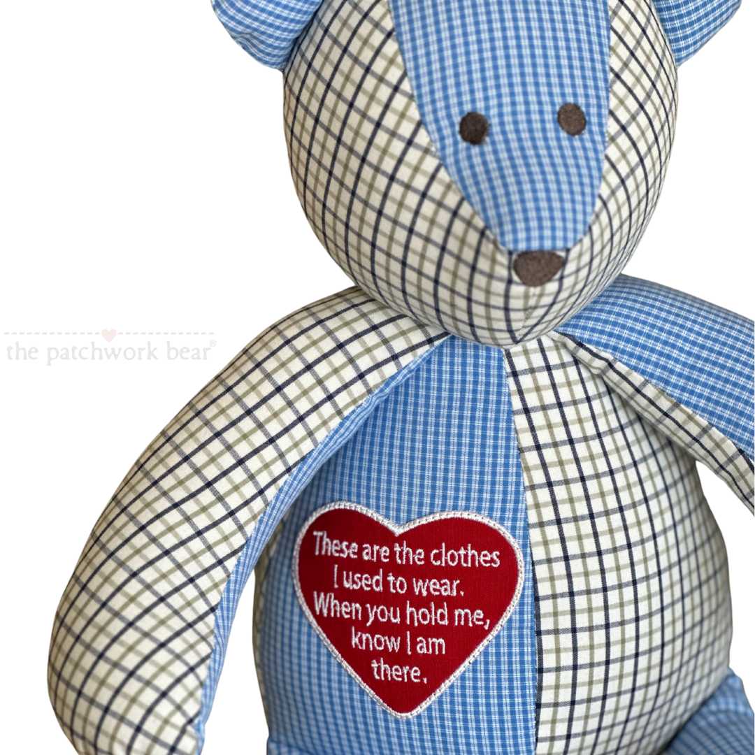 Close-up of patchwork bear with poem on heart