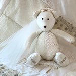 Bride bear wearing a veil and a wedding dress