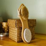 Wooden foot brush with pumice stone.
