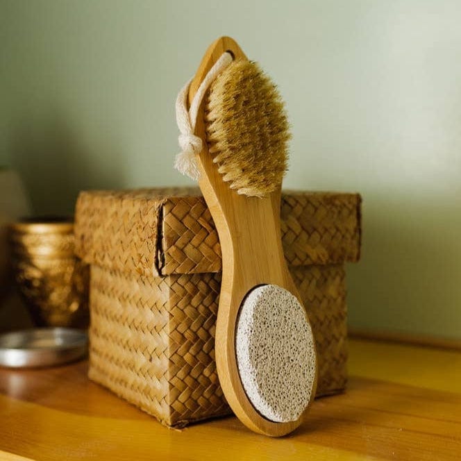 Wooden foot brush with pumice stone.
