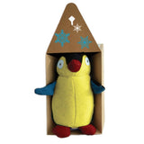 Stuffed yellow penguin toy in a cardboard box.