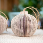 Two paper book page ornaments
