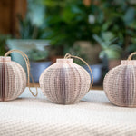 Three paper globe ornaments.