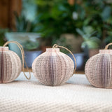 Three paper globe ornaments.
