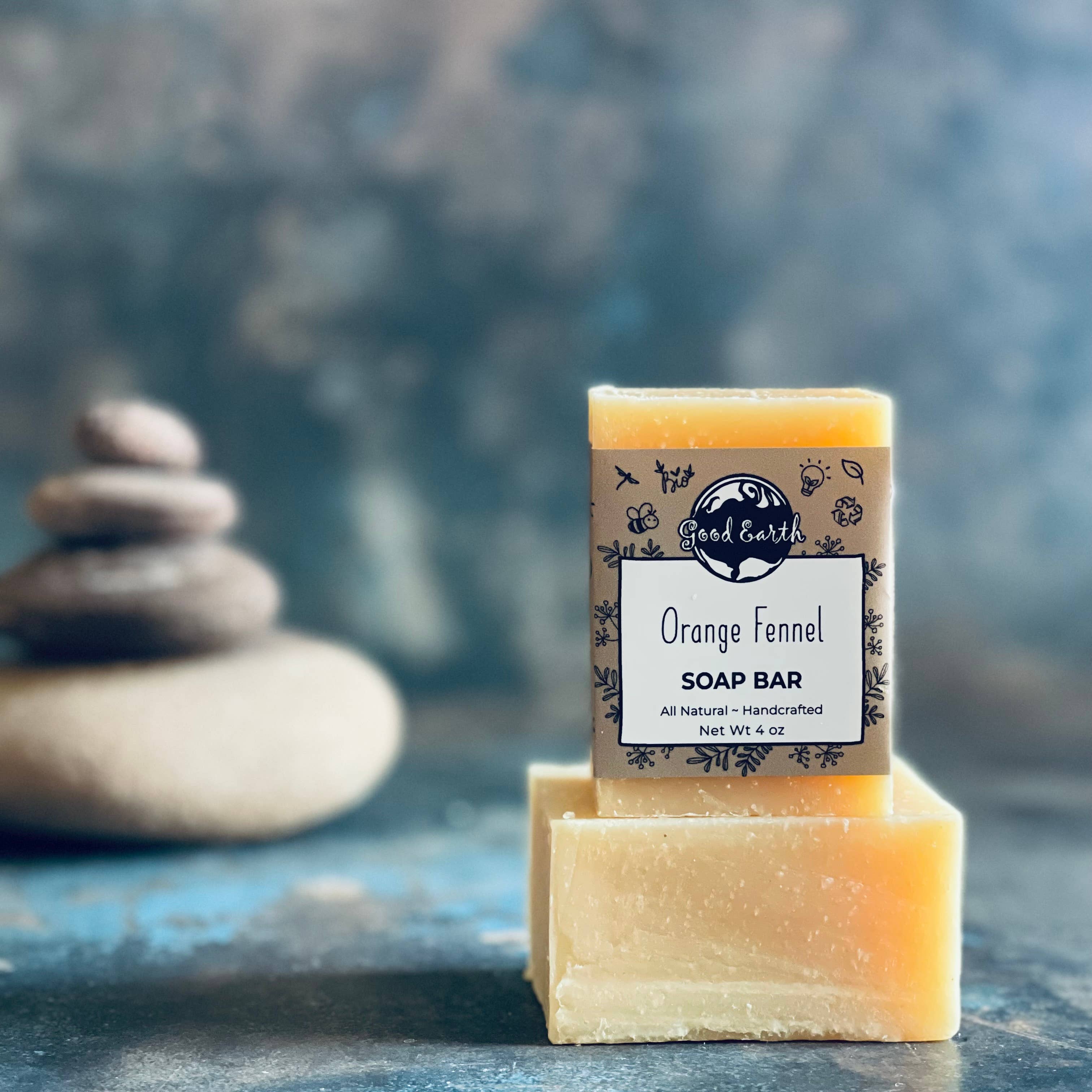 Orange fennel soap bar with a stack of stones.