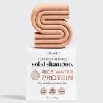 Solid shampoo bar on top of a product box.