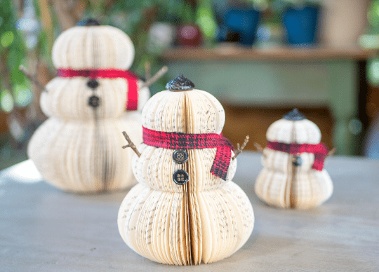 Three snowmen made of books.