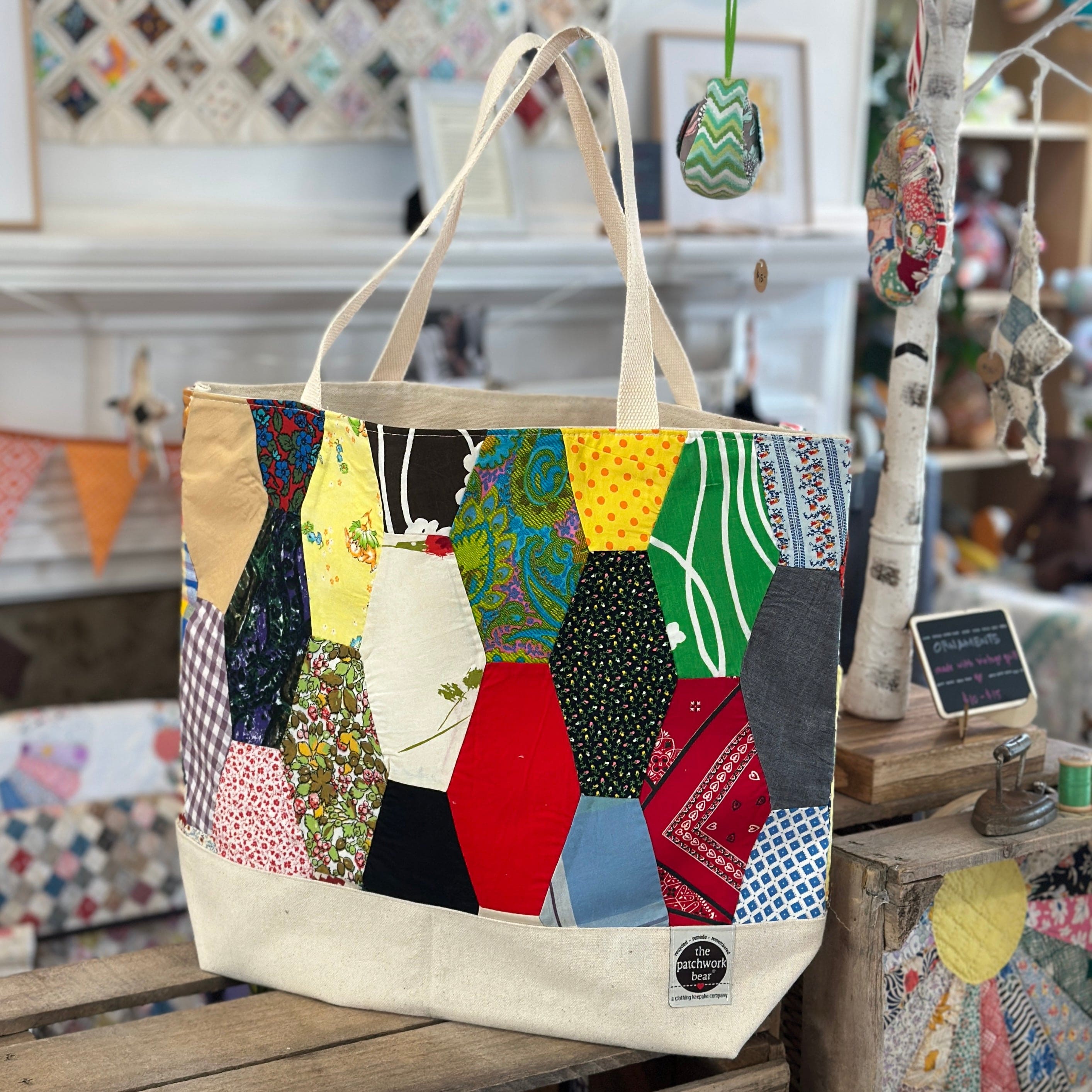 Tote bag with colorful patchwork design.