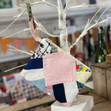 Patchwork clutch purse with handle.