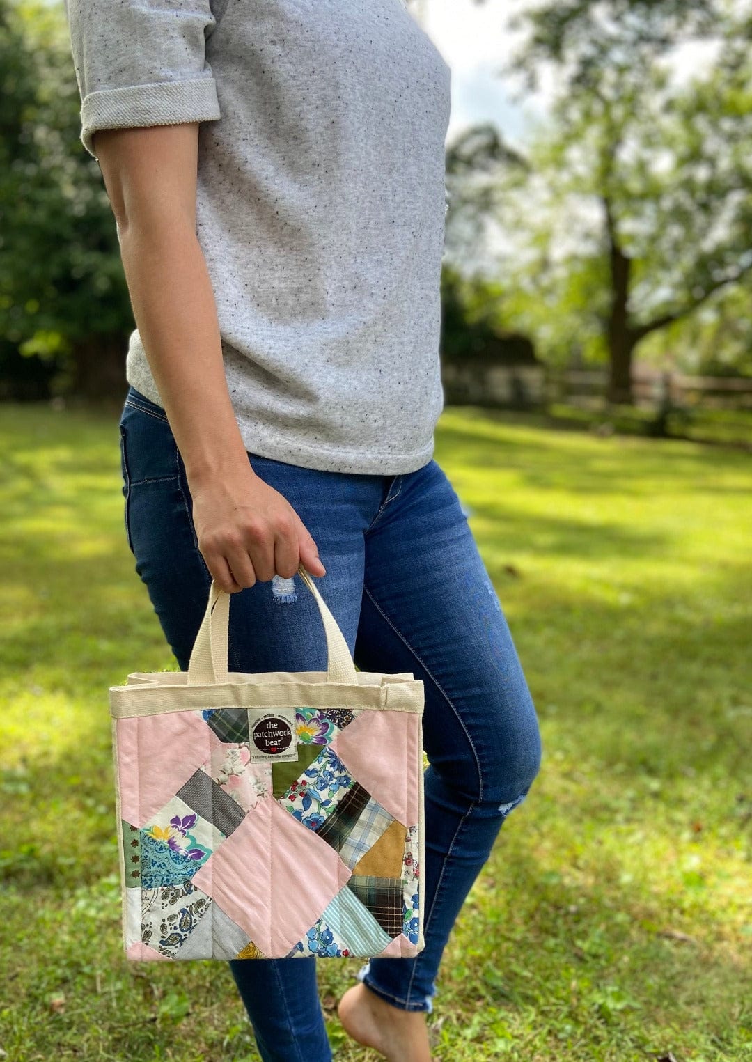 Woman holding patchwork bag, Photo Sep 12, 2023