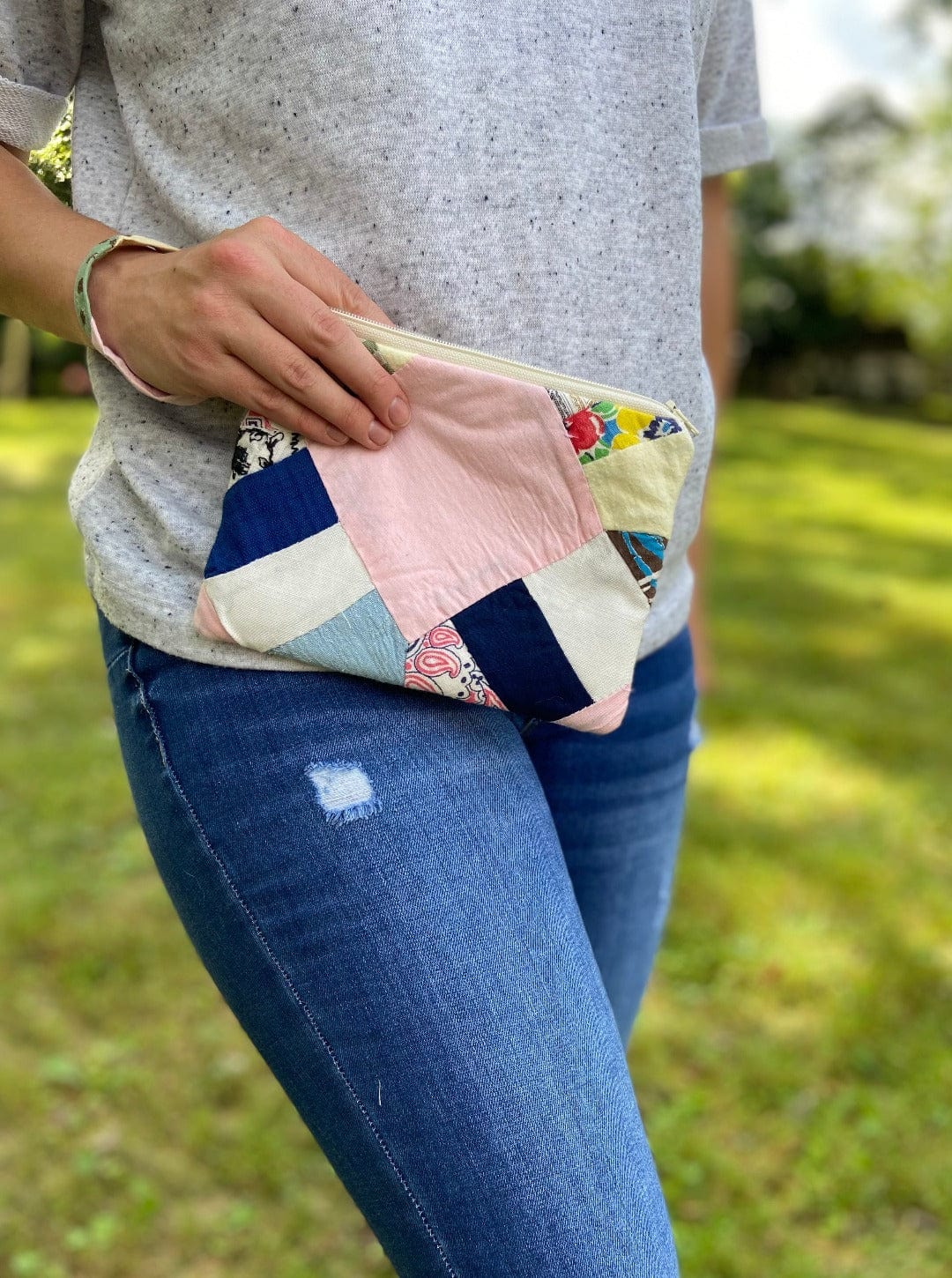 Woman holding patchwork clutch, photo Sep 12, 2023