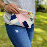 Woman holding patchwork clutch, photo Sep 12, 2023