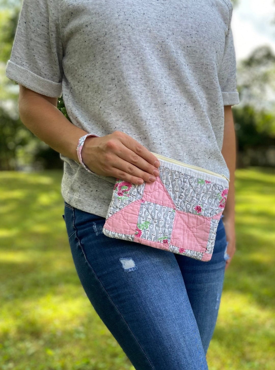 Woman holding pink quilt pouch, photo Sep 12 2023