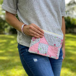 Woman holding pink quilt pouch, photo Sep 12 2023