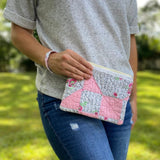 Woman holding pink quilt pouch, photo Sep 12 2023