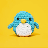 Crocheted blue penguin on yellow background - ScreenShot 2023-06-16
