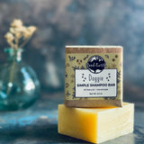 Doggie shampoo bar on top of a larger soap bar.