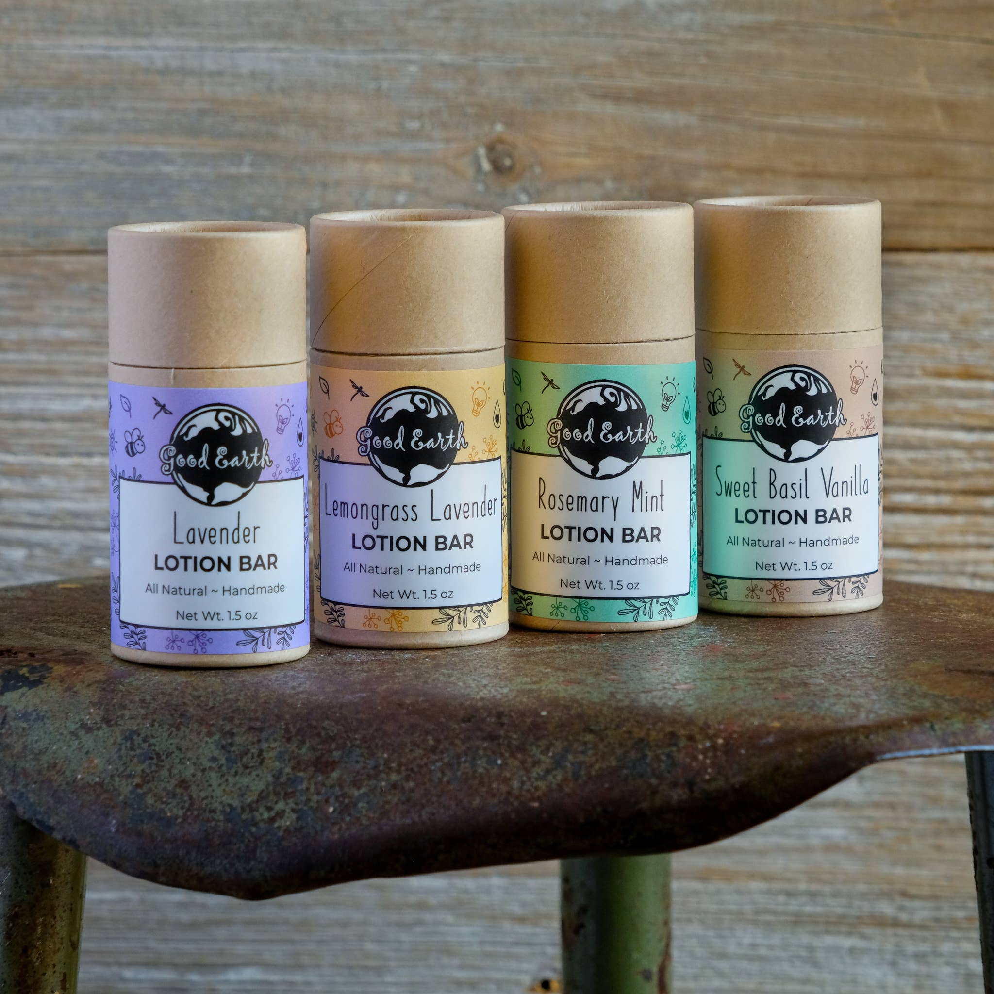 Four lotion bars on a rustic surface.