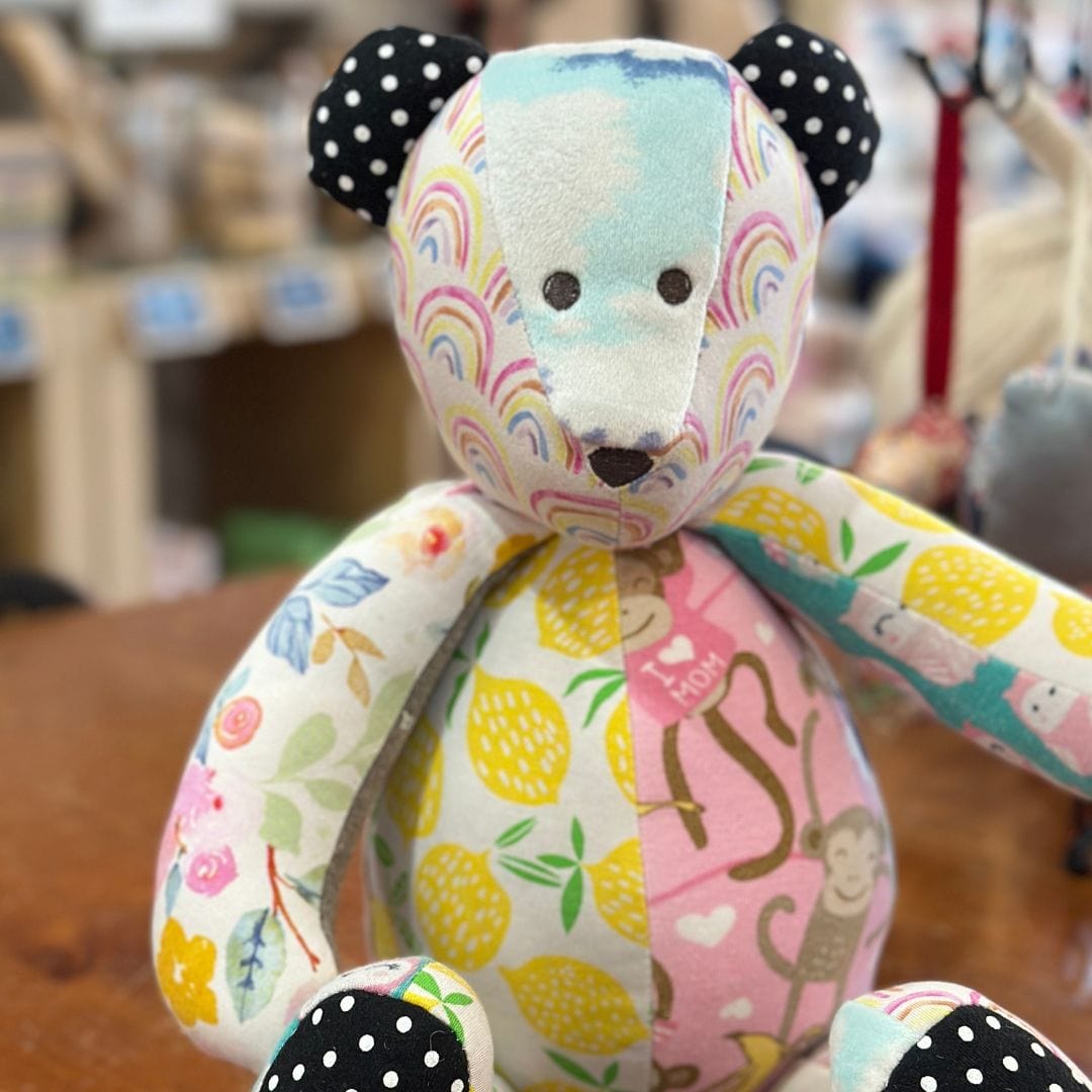 Baby bear stuffed animal with colorful patchwork detail