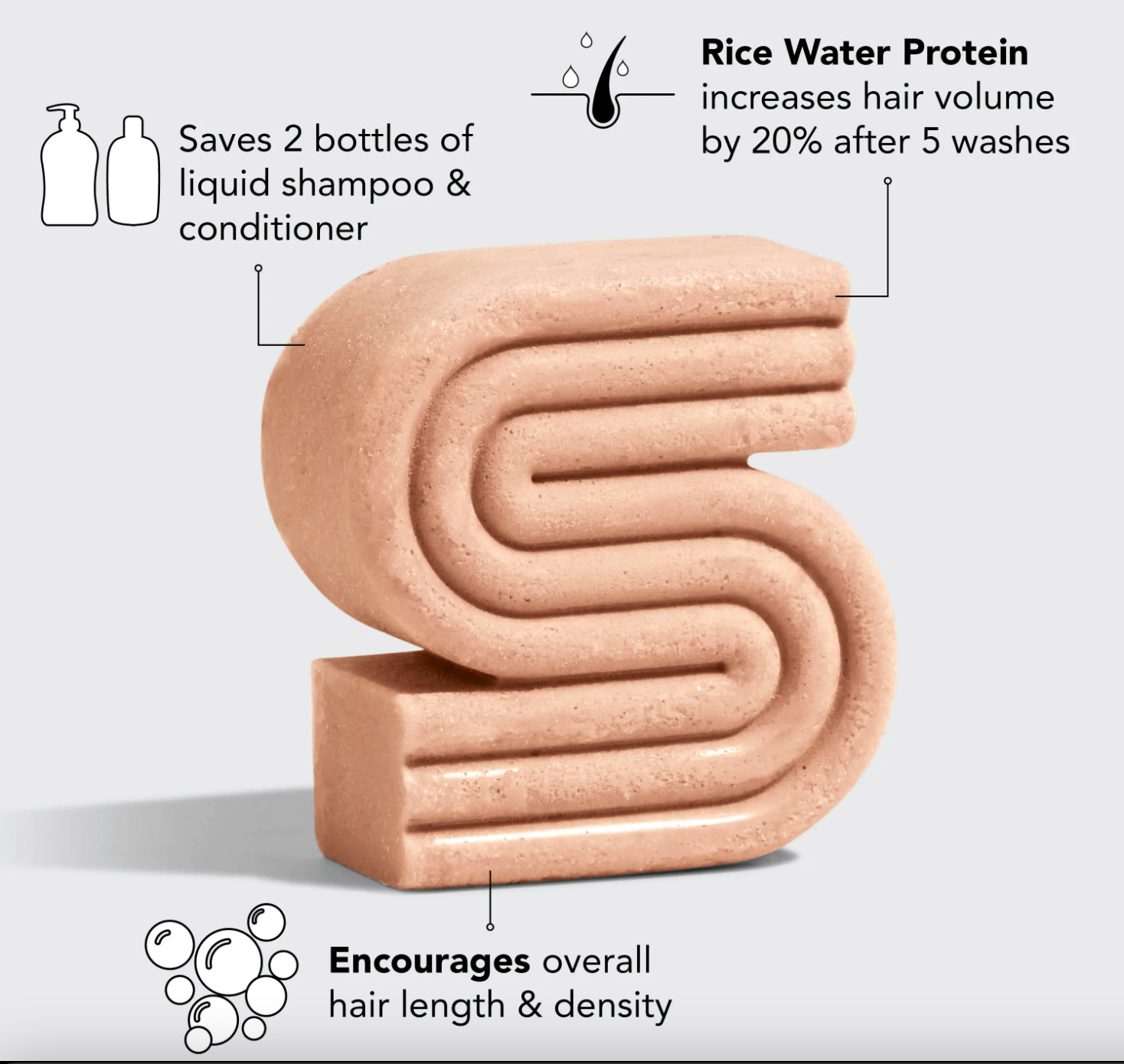 Pink, S-shaped hair care product bar with labels.