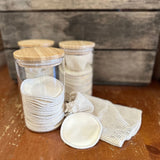 Hemp facial rounds in glass jars with wooden lids.