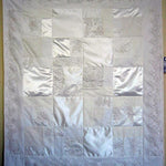 Lee's wedding quilt with white satin and lace details