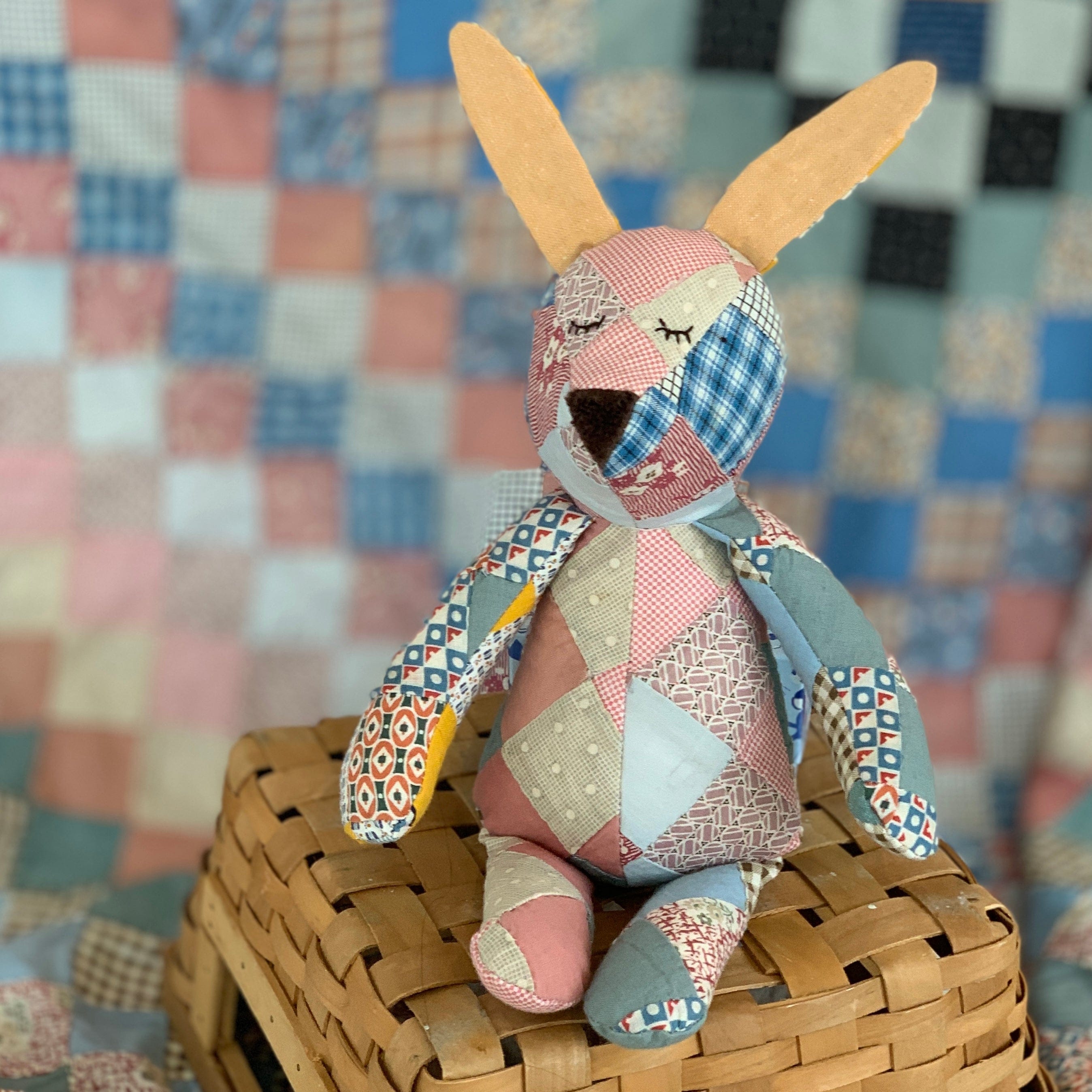 1910s Bitty Bunny patchwork stuffed animal on basket