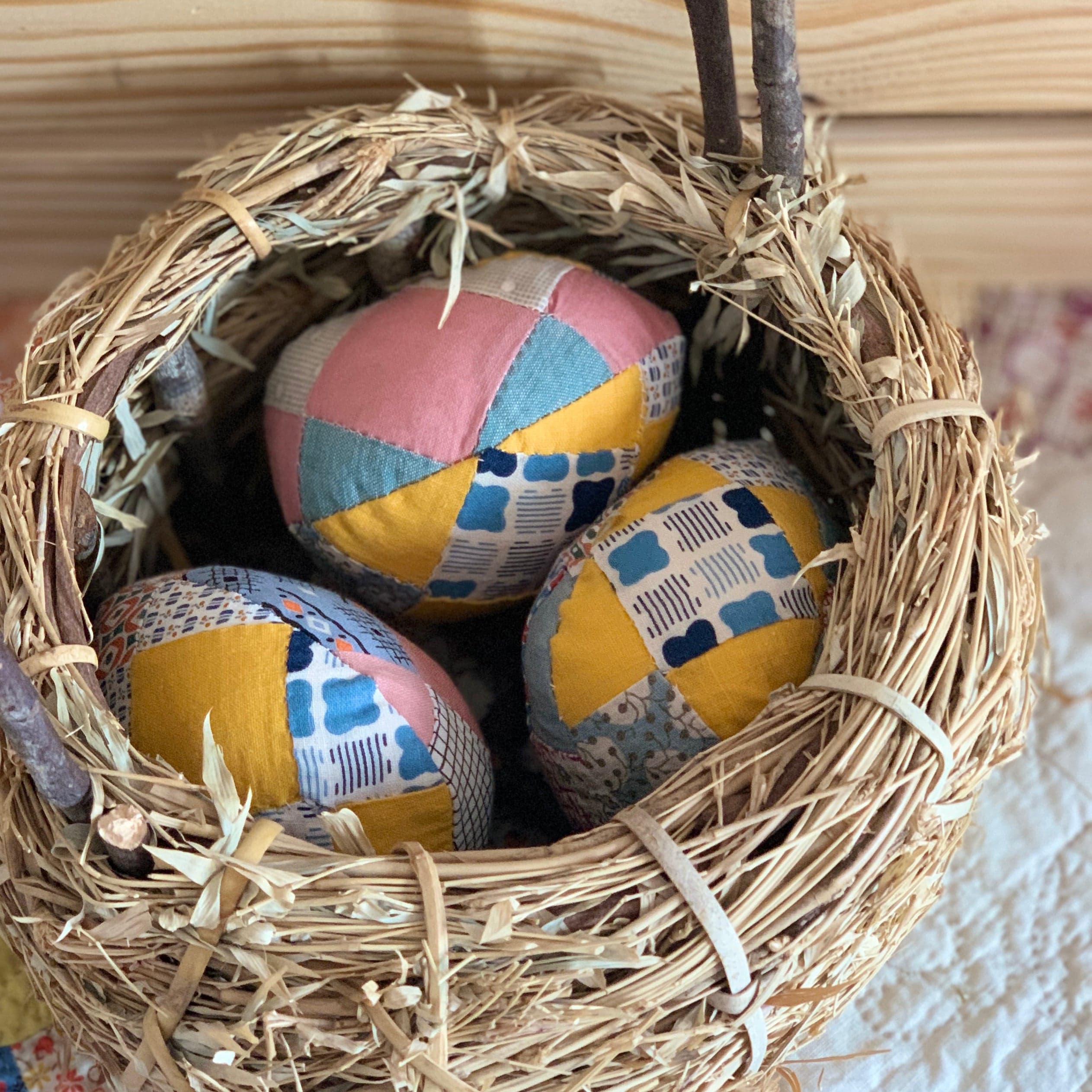 Patchwork eggs in nest