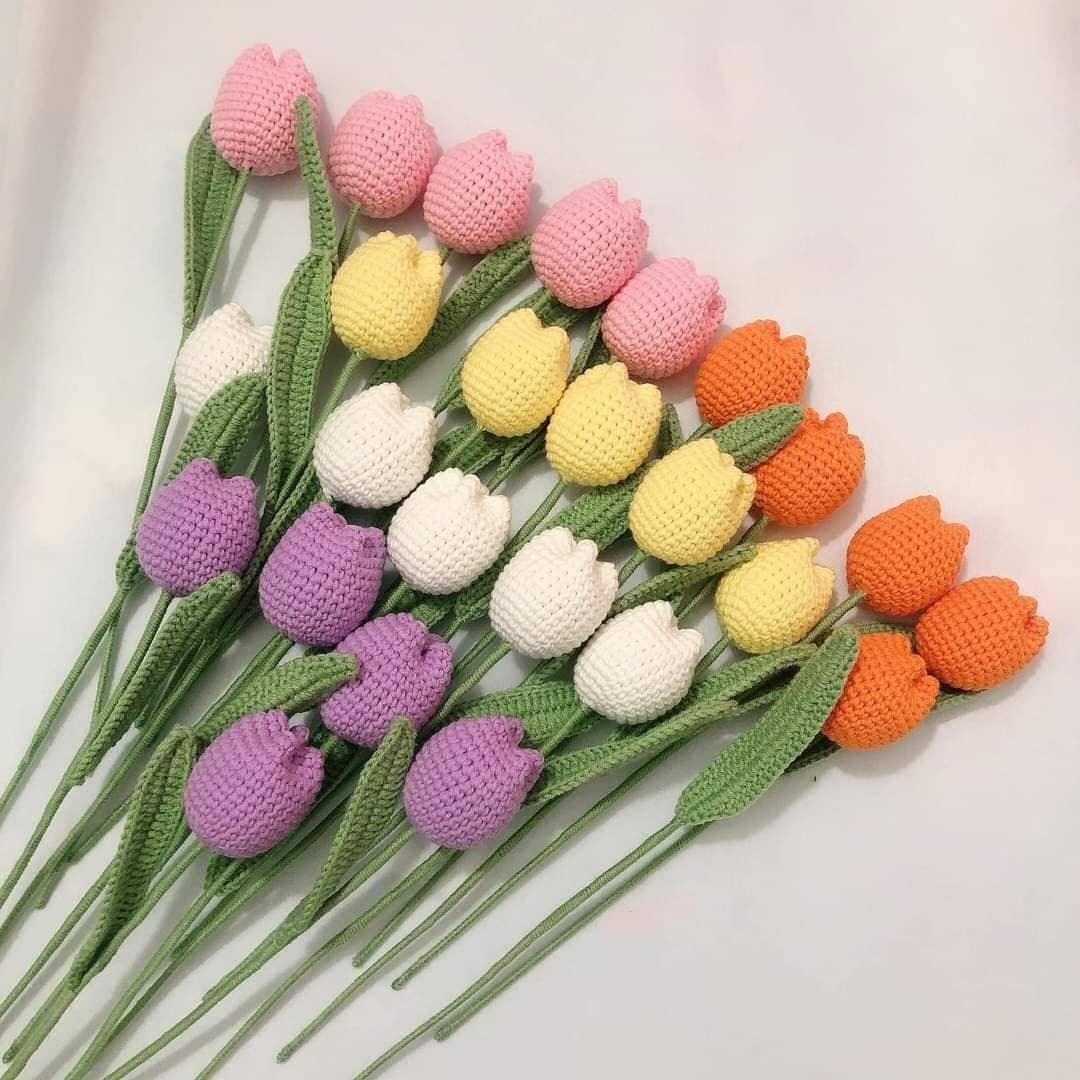 Crocheted tulips in various colors.
