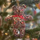 Bear ornament hanging on Christmas tree