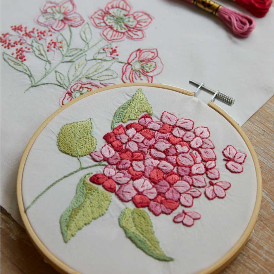 Embrace the tranquility of nature and let your creativity blossom with these blissful blooms. This beginner-friendly embroidery kit includes step-by-step instructions, making it easy to unwind with soul-soothing stitching. This Kit Includes 9 Skeins of Embroidery Floss (8m), 2 Preprinted Pieces of Fabric (100% Cotton)10.2in X 10.2in, an Embroidery Needle, Wooden Embroidery Hoop, 6.2in, Instructions, Design Size 4.7in X4.7in and 4.9 in X 4.9in.