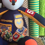 Stuffed bear with Boy Scout patches.