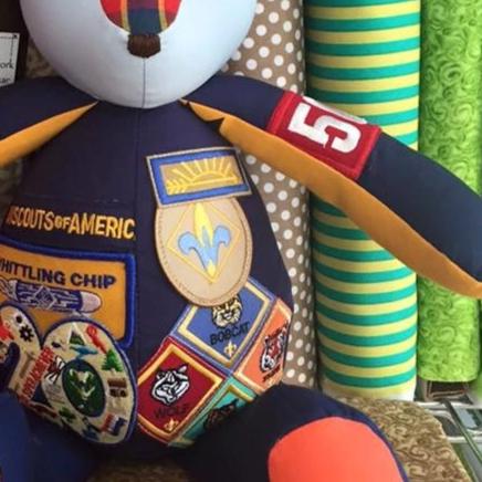 Stuffed bear with Boy Scout patches.
