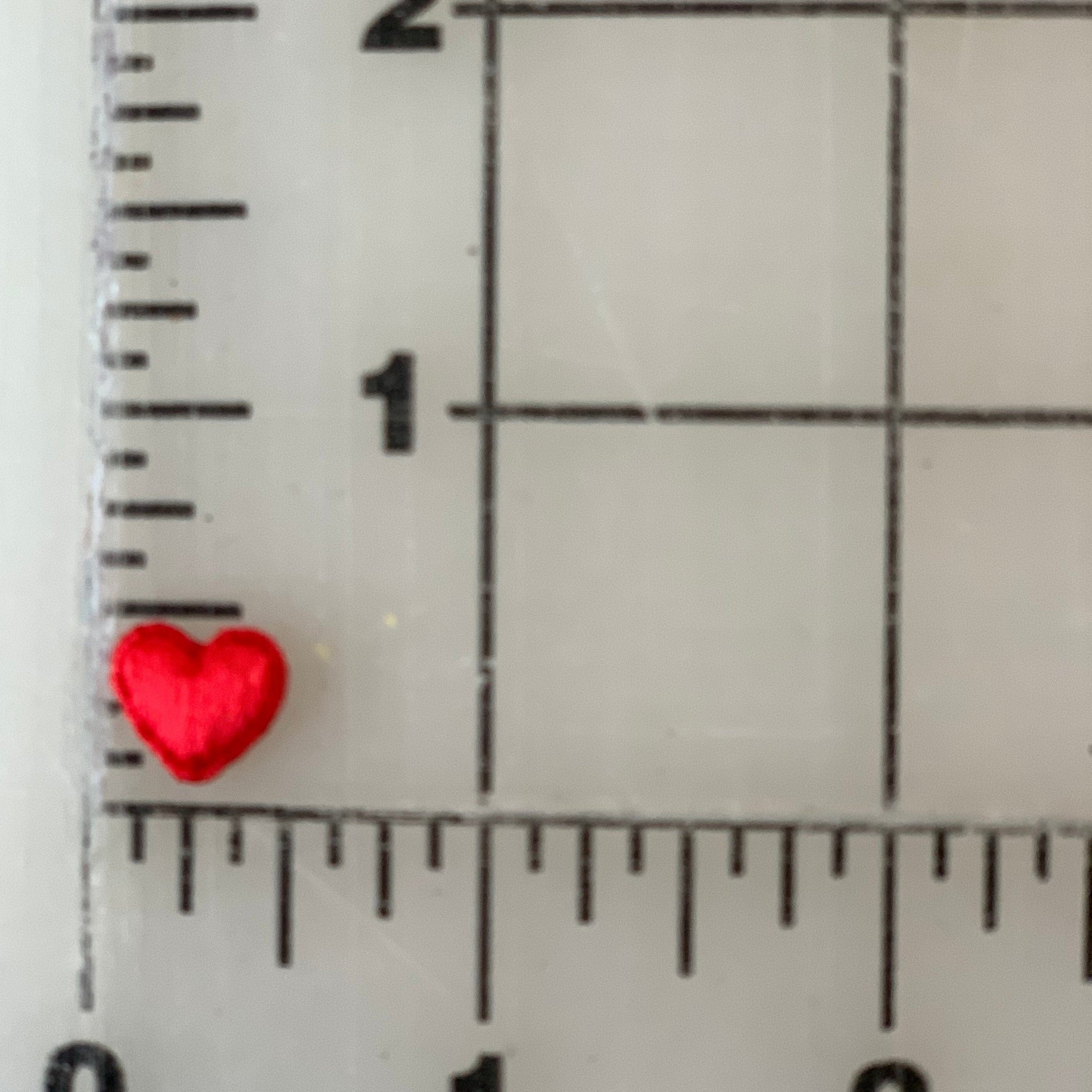 Red heart next to ruler.