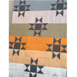 Ohio Star baby quilt with sunset colors