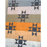 Ohio Star baby quilt with sunset colors