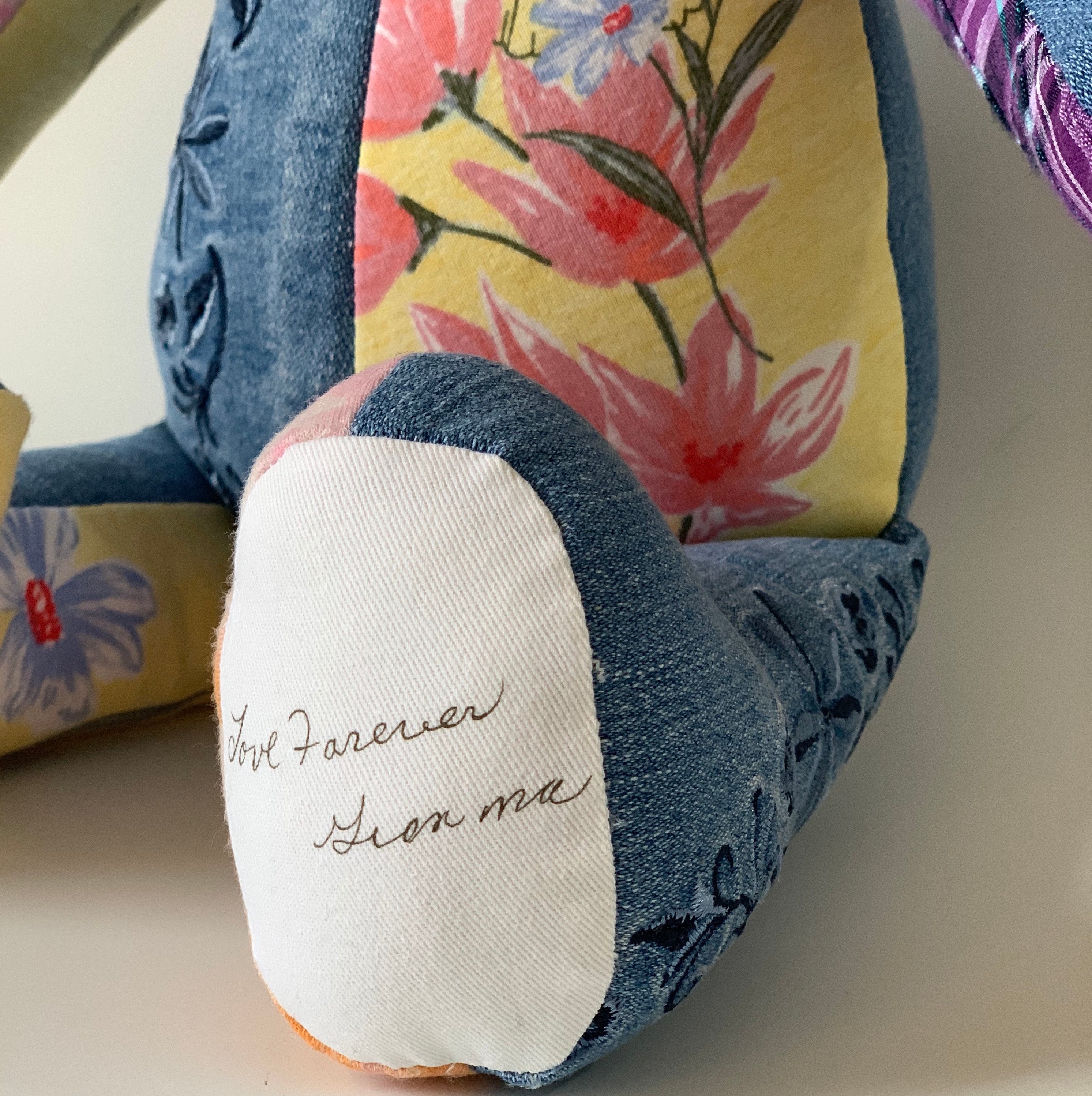 Signature transfer on denim bear foot