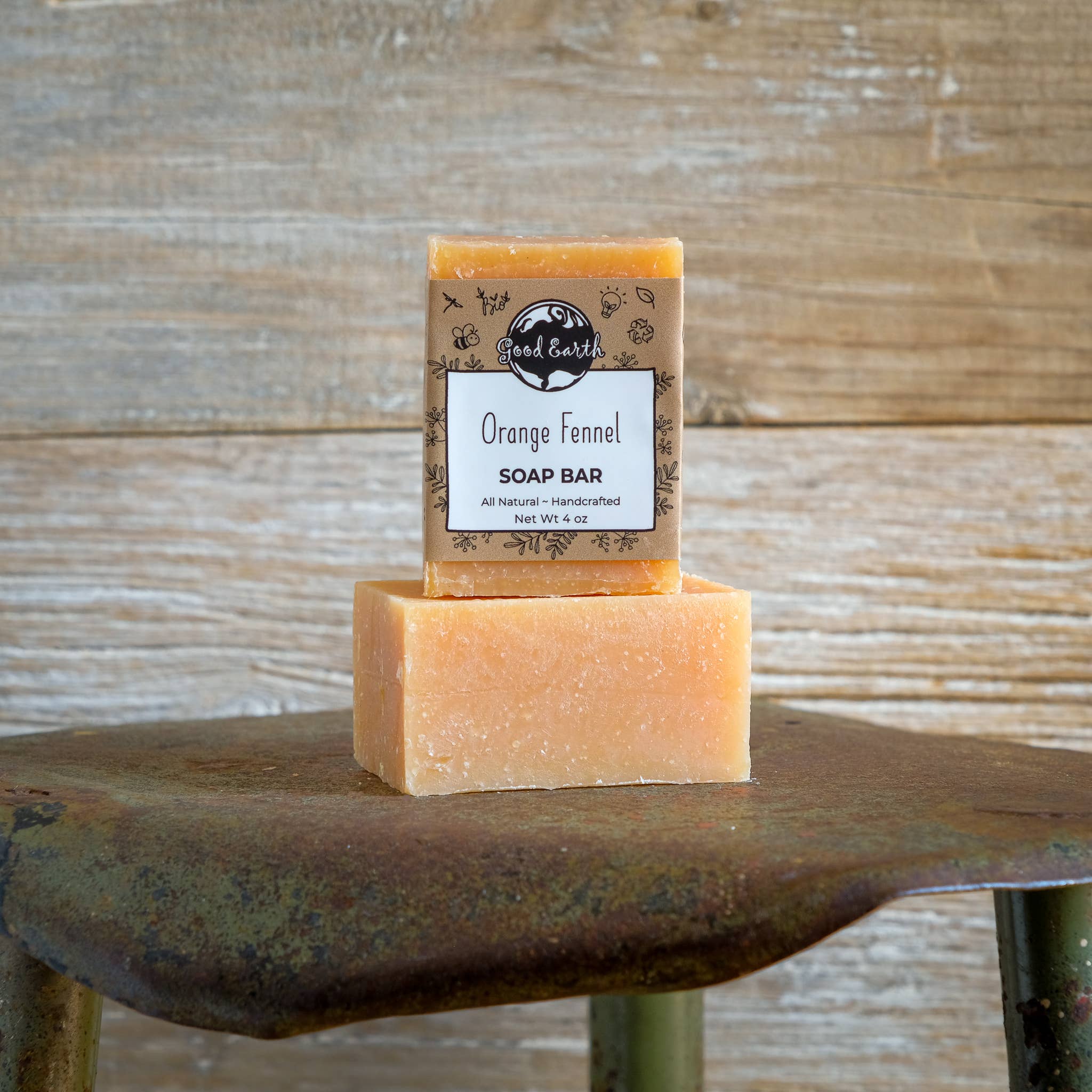 Two orange soap bars, one stacked on the other.
