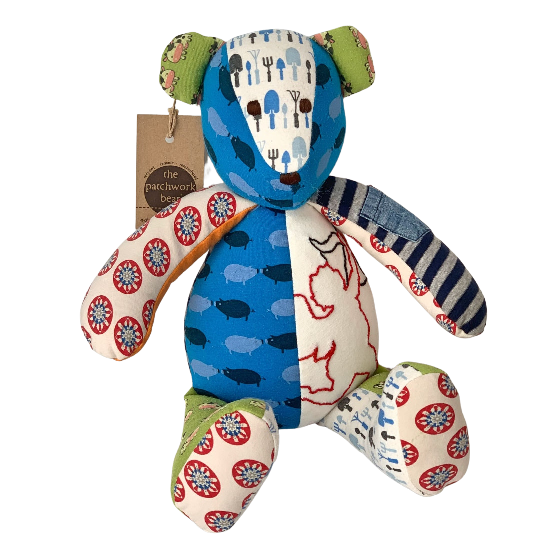 Baby boy onesies used to make this memory bear. Onesies and sleepers paired with blankets and memories