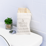 Toilet bombs bag on toilet with plant.