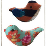Memory bird plushies with floral and patterned designs.