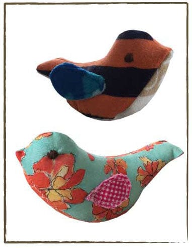 Memory bird plushies with floral and patterned designs.