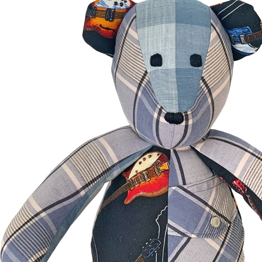 Memory bear with guitar detail.