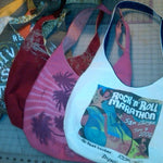 Upcycled tote bags made from repurposed shirts.